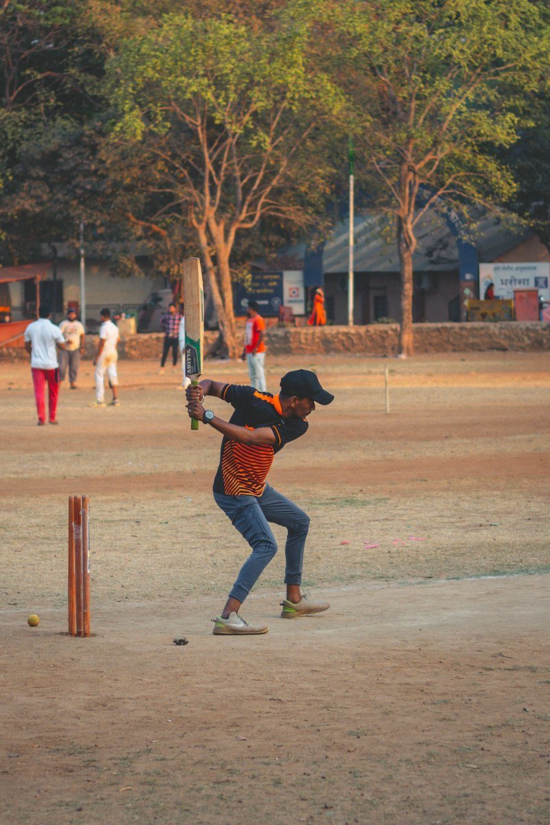 Cricket batter preparing to play a shot
