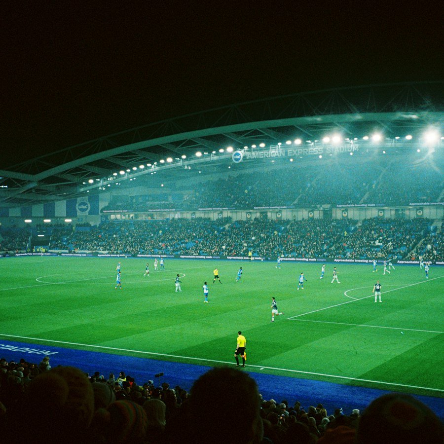 Football match at a stadium under lights