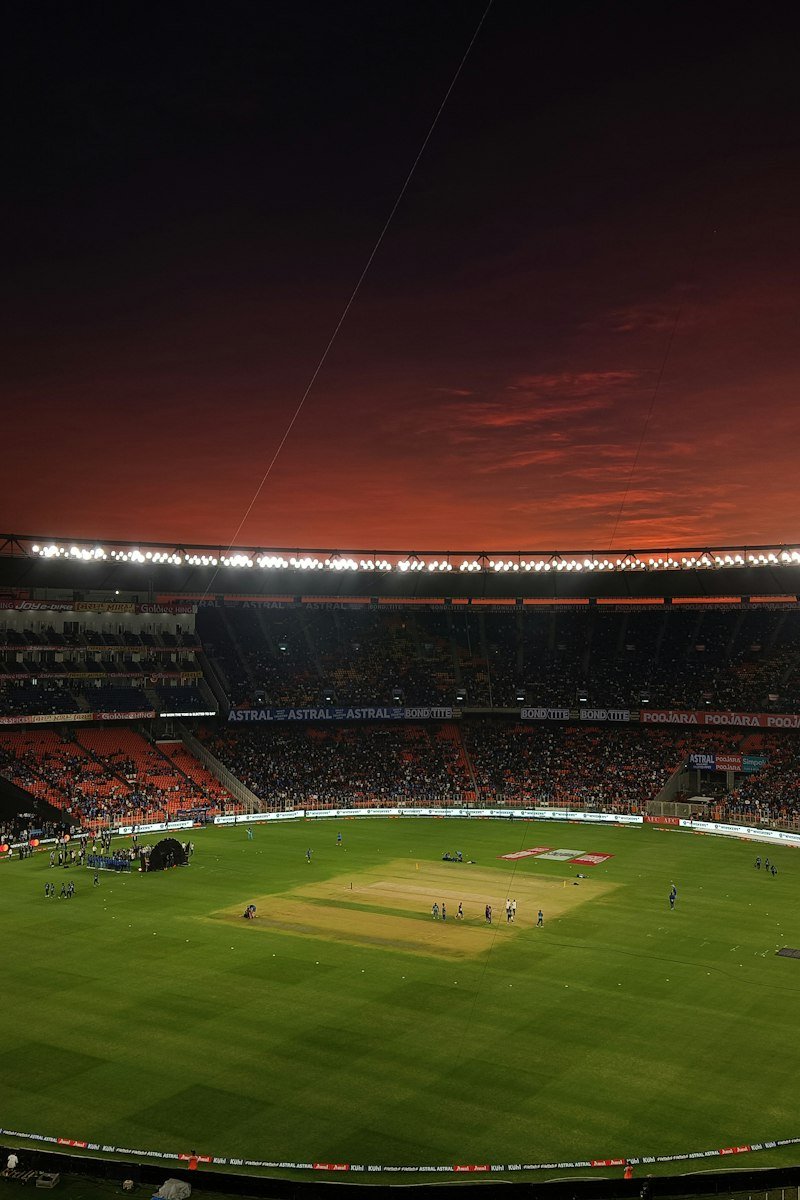 Cricket pitch at an evening stadium